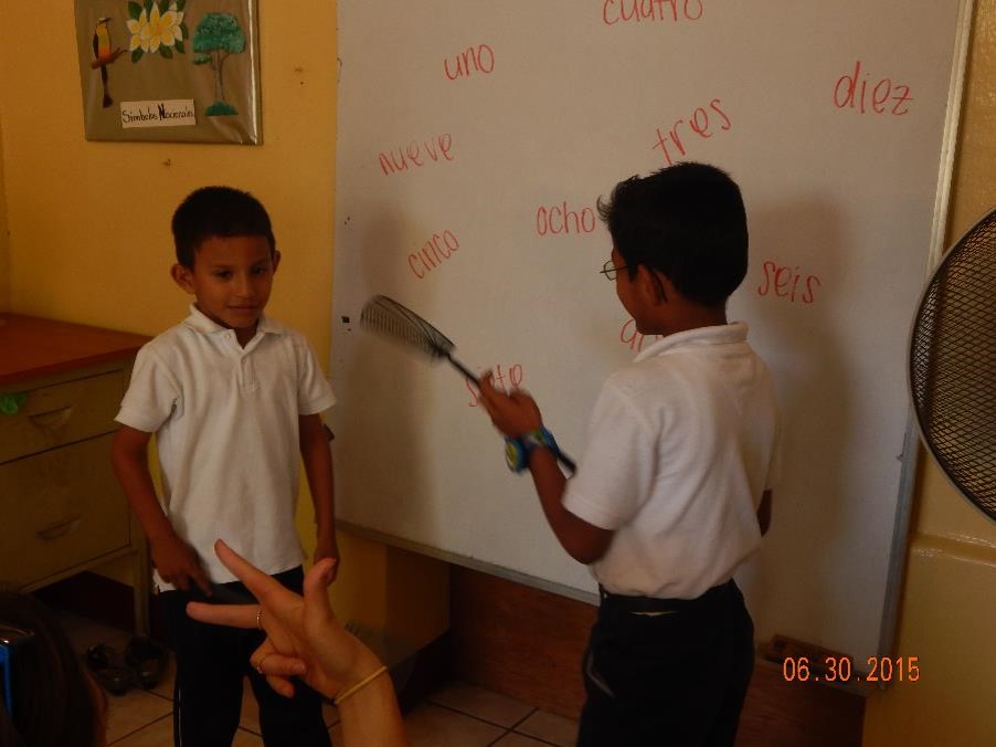 Working toward automaticity between the signs and the printed Spanish. These kindergartners were practicing their vocabulary by quickly swatting the correct word.